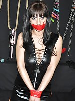 Slutty slave poses in tape bondage and handcuffs